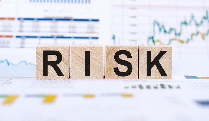 Risk Word Written On Wooden Cubes. Financial Risk Assessment, Ri